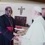 Bishop Eduardo receiving gift from Pope Francis