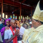 Over 260 Catholics Receive Sacrament of Confirmation in Honor of Late Bishop Joseph Gasi Abangite By Baraka John As the Christian community marked 11th anniversary of the passing of the late Bishop Emeritus Joseph Gasi Abangite, 268 Catholics on Friday 12th 2025 in a solemn celebration received the sacrament of confirmation in his honor. Confirmation in the Catholic Church is the sacrament that strengthens and completes a Christian's initiation into the faith. It empowers them with the Holy Spirit to live a faithful, courageous life of discipleship in the Church and the world. It is a sacred rite in which a baptized person is strengthened and sealed with the gift of the Holy Spirit. In his Homily, Bishop Hiiboro encouraged the new faithful to embrace the spirit of Holy Spirit in their daily lives, and love for humanity. “This sacrament is not just a rite of passage,” said bishop, “It is a continuation of Bishop Gasi’s legacy a legacy rooted in deep faith, hope, and love for his people. Today, you take on the responsibility of living as true Christians, just as Bishop Gasi encouraged us to.” The anniversary, held at St. Mary’s Cathedral in Yambio, brought together faithful from across the diocese. The event was presided over by the diocesan bishop, His lordship Eduardo Hiiboro Kusala who offered special blessings in remembrance of Bishop Gasi’s life, legacy, and service to the Church. Bishop Joseph Gasi Abangite, who served as the Bishop of the Catholic Diocese of Tombura-Yambio for several decades, is remembered as a pillar of faith and unity during some of South Sudan’s most turbulent years. His pastoral care, commitment to peace, and dedication to the spiritual growth of his flock continue to inspire generations. The sacrament of confirmation, which strengthens the baptized in their faith through the gifts of the Holy Spirit, was administered to over 300 candidates a symbolic gesture reflecting the ongoing spiritual growth within the diocese. The Diocese of Tombura-Yambio commemorates Bishop Gasi’s life annually, using the occasion to renew the faith of its members and inspire future generations to walk in his footsteps. Over 260 Catholics Receive Sacrament of Confirmation in Honor of Late Bishop Joseph Gasi Abangite By Baraka John As the Christian community marked 11th anniversary of the passing of the late Bishop Emeritus Joseph Gasi Abangite, 268 Catholics on Friday 12th 2025 in a solemn celebration received the sacrament of confirmation in his honor. Confirmation in the Catholic Church is the sacrament that strengthens and completes a Christian's initiation into the faith. It empowers them with the Holy Spirit to live a faithful, courageous life of discipleship in the Church and the world. It is a sacred rite in which a baptized person is strengthened and sealed with the gift of the Holy Spirit. In his Homily, Bishop Hiiboro encouraged the new faithful to embrace the spirit of Holy Spirit in their daily lives, and love for humanity. “This sacrament is not just a rite of passage,” said bishop, “It is a continuation of Bishop Gasi’s legacy a legacy rooted in deep faith, hope, and love for his people. Today, you take on the responsibility of living as true Christians, just as Bishop Gasi encouraged us to.” The anniversary, held at St. Mary’s Cathedral in Yambio, brought together faithful from across the diocese. The event was presided over by the diocesan bishop, His lordship Eduardo Hiiboro Kusala who offered special blessings in remembrance of Bishop Gasi’s life, legacy, and service to the Church. Bishop Joseph Gasi Abangite, who served as the Bishop of the Catholic Diocese of Tombura-Yambio for several decades, is remembered as a pillar of faith and unity during some of South Sudan’s most turbulent years. His pastoral care, commitment to peace, and dedication to the spiritual growth of his flock continue to inspire generations. The sacrament of confirmation, which strengthens the baptized in their faith through the gifts of the Holy Spirit, was administered to over 300 candidates a symbolic gesture reflecting the ongoing spiritual growth within the diocese. The Diocese of Tombura-Yambio commemorates Bishop Gasi’s life annually, using the occasion to renew the faith of its members and inspire future generations to walk in his footsteps. Bishop Hiiboro giving sacrament of confirmation, Picture by Ernesto Joseph Chakaya